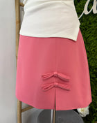 Falda corta rosa lazos 
