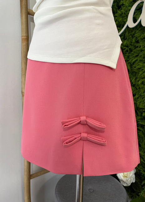 Falda corta rosa lazos 